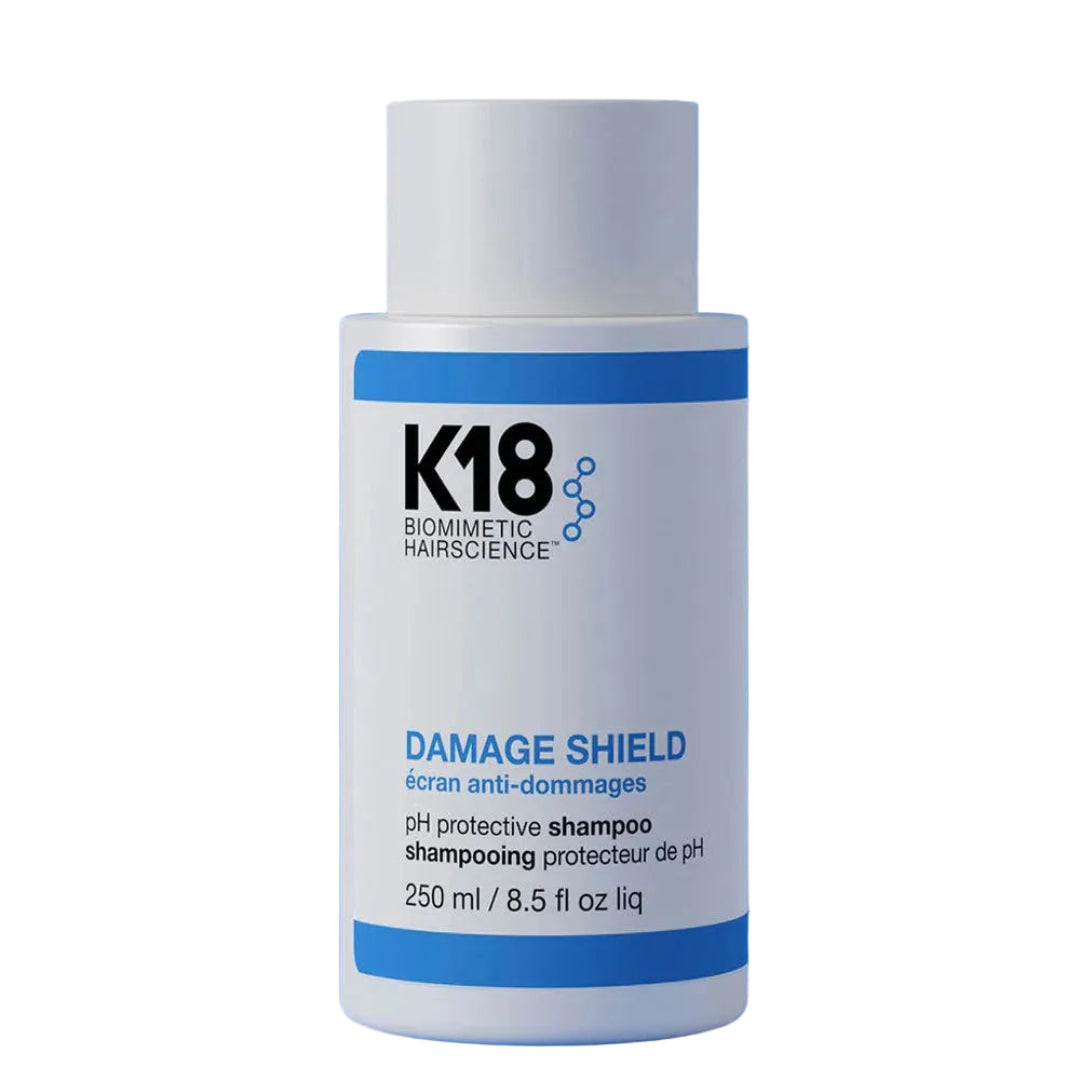 Shampoo K18 Damage Shield 250ml. Limpieza suave que actúa como escudo protector contra los rayos UV y el daño ambiental.